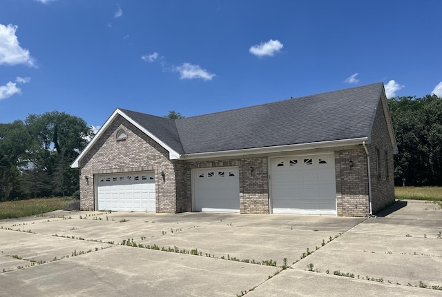 6130 N Jeffrey Ln, Oregon, IL 61061 - view of front facade featuring brick siding, a shingled roof, and driveway