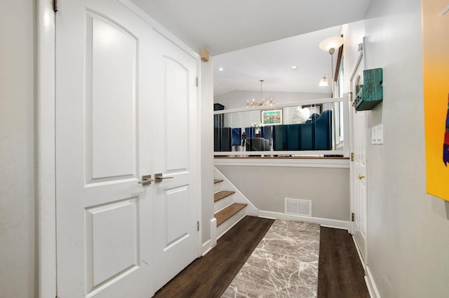 9050 Tamaroa Ter, Skokie, IL 60076 - hall with dark wood-type flooring, a chandelier, and lofted ceiling