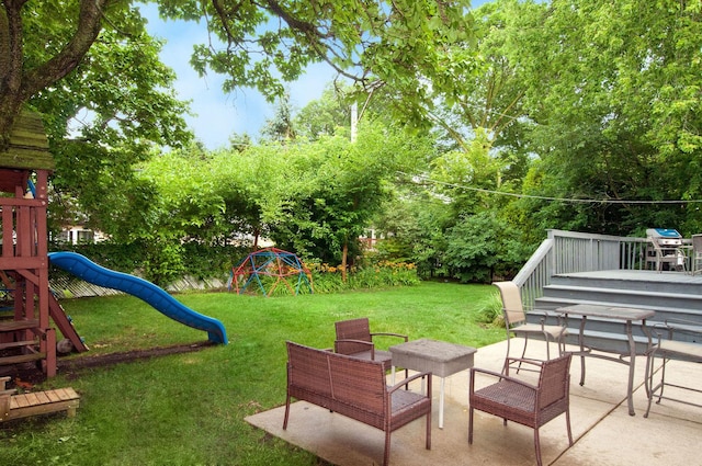 9050 Tamaroa Ter, Skokie, IL 60076 - view of green lawn with a playground, a patio, and view of wooded area