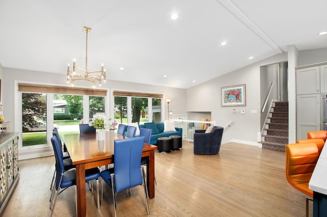9050 Tamaroa Ter, Skokie, IL 60076 - dining room with vaulted ceiling, light wood-style floors, healthy amount of natural light, a chandelier, and stairs
