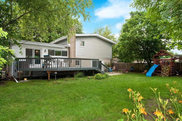 9050 Tamaroa Ter, Skokie, IL 60076 - back of house with a wooden deck, a playground, a chimney, and a patio
