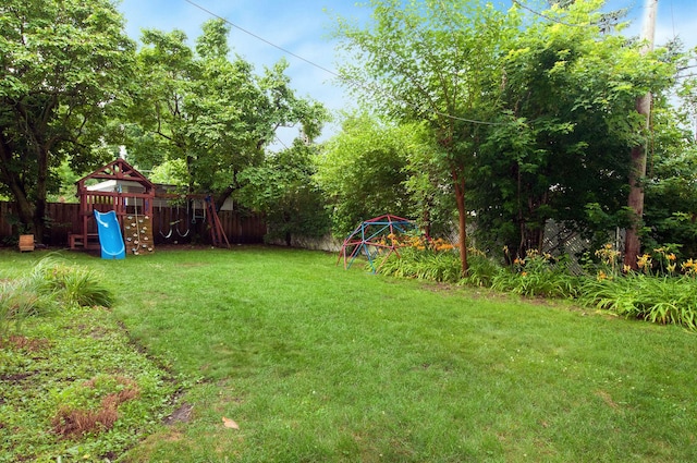 9050 Tamaroa Ter, Skokie, IL 60076 - fenced backyard with a playground