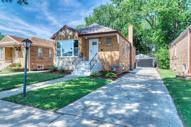 8916 S Sacramento Ave, Evergreen Park, IL 60805 - bungalow-style home with brick siding, an outbuilding, a chimney, and a front yard