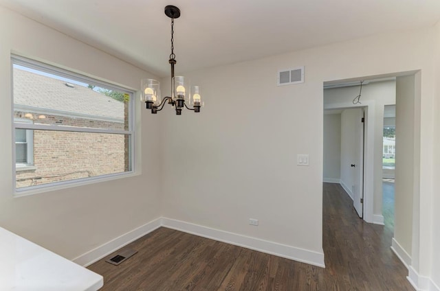 8916 S Sacramento Ave, Evergreen Park, IL 60805 - unfurnished dining area with a chandelier and dark wood-style flooring