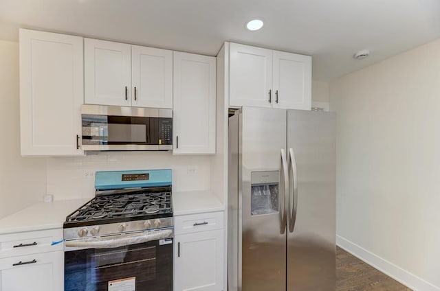 8916 S Sacramento Ave, Evergreen Park, IL 60805 - kitchen featuring appliances with stainless steel finishes, white cabinetry, light countertops, dark wood-style flooring, and recessed lighting