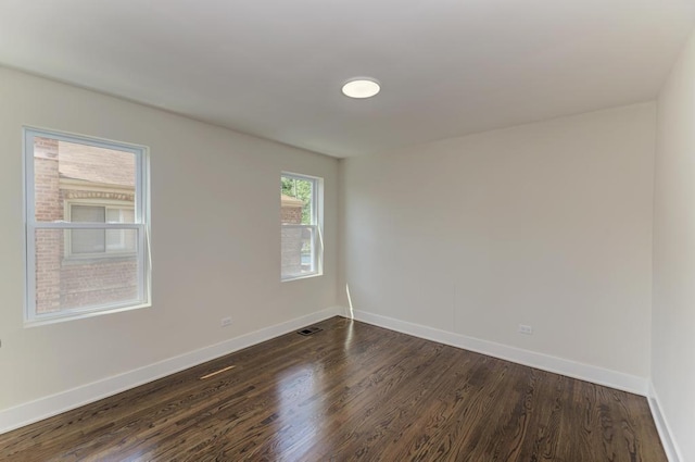 8916 S Sacramento Ave, Evergreen Park, IL 60805 - unfurnished room with dark wood-type flooring and baseboards