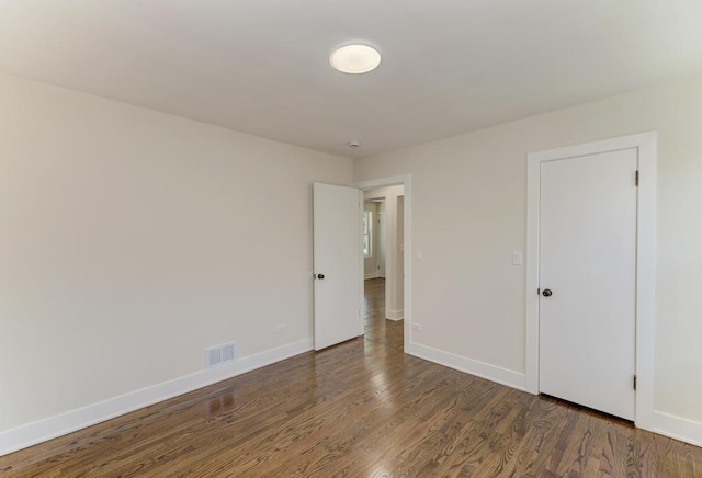8916 S Sacramento Ave, Evergreen Park, IL 60805 - unfurnished bedroom with wood finished floors and baseboards