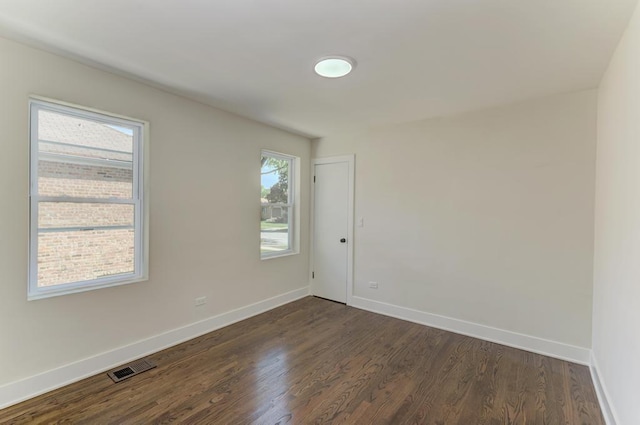 8916 S Sacramento Ave, Evergreen Park, IL 60805 - unfurnished room with dark wood-style floors and baseboards