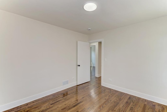 8916 S Sacramento Ave, Evergreen Park, IL 60805 - empty room featuring baseboards and wood finished floors