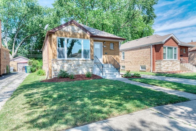 8916 S Sacramento Ave, Evergreen Park, IL 60805 - view of front facade featuring stone siding, an outdoor structure, and a front yard