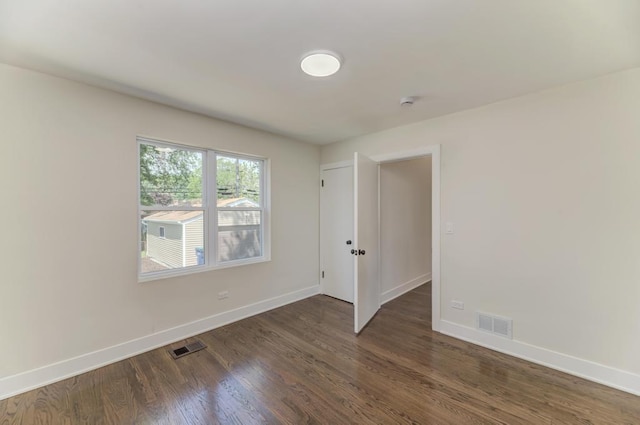 8916 S Sacramento Ave, Evergreen Park, IL 60805 - spare room with wood finished floors and a smoke detector