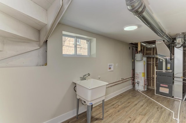 8916 S Sacramento Ave, Evergreen Park, IL 60805 - basement with gas water heater, heating unit, and wood finished floors