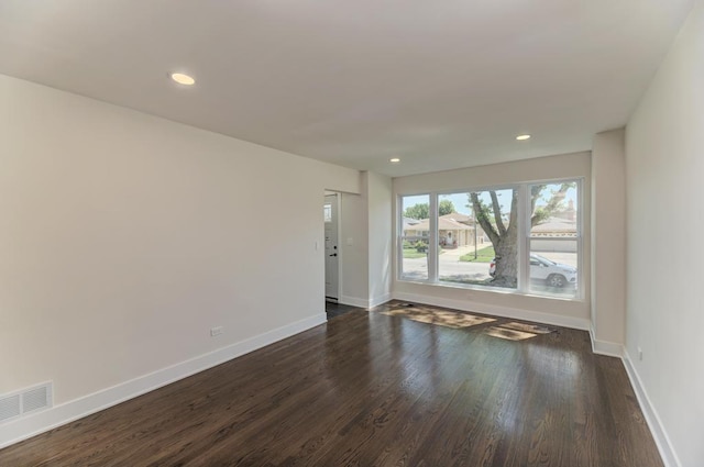 8916 S Sacramento Ave, Evergreen Park, IL 60805 - unfurnished room featuring dark wood-style flooring and recessed lighting