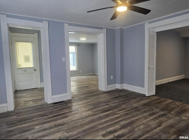207 W Main St, La Harpe, IL 61450 - unfurnished room featuring dark wood-style floors, a ceiling fan, and ornamental molding