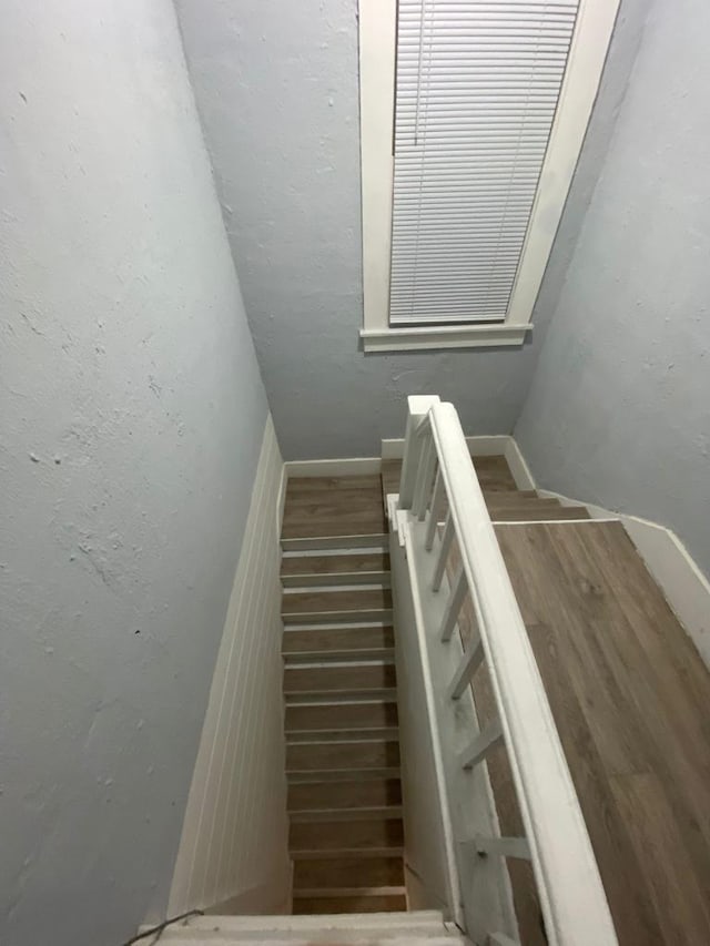 207 W Main St, La Harpe, IL 61450 - stairs featuring wood finished floors