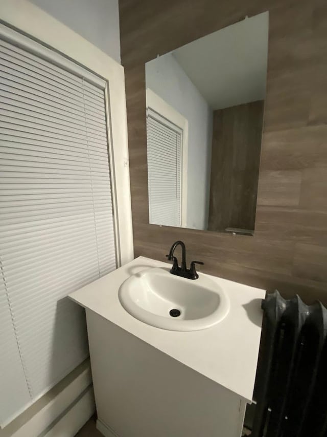 207 W Main St, La Harpe, IL 61450 - bathroom featuring tile walls and vanity