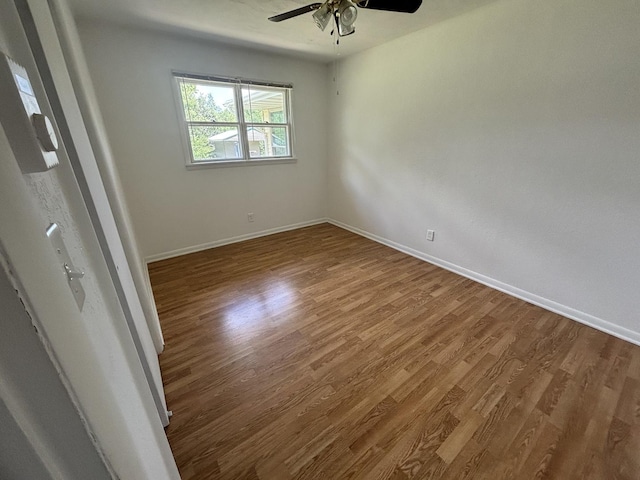 3667 Arthesia St E, Armstrong, IL 61812 - empty room with a ceiling fan and wood finished floors
