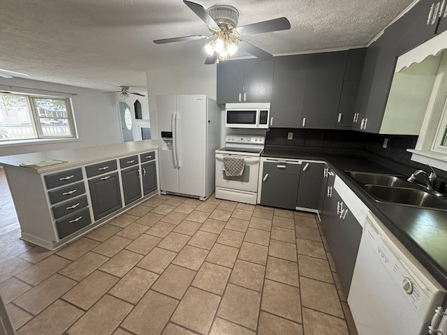 3667 Arthesia St E, Armstrong, IL 61812 - kitchen with white appliances, ceiling fan, a textured ceiling, a peninsula, and dark countertops