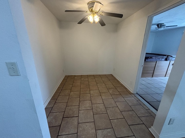 3667 Arthesia St E, Armstrong, IL 61812 - unfurnished room with a ceiling fan and brick patterned floors