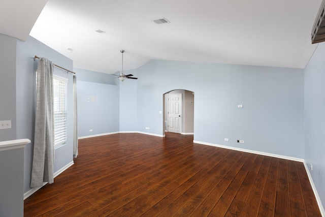 395 Cascade Ln Unit 0, Oswego, IL 60543 - empty room featuring lofted ceiling, a ceiling fan, dark wood-style flooring, and arched walkways