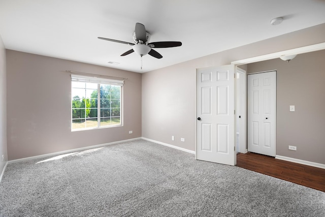 395 Cascade Ln Unit 0, Oswego, IL 60543 - unfurnished bedroom with dark colored carpet and ceiling fan