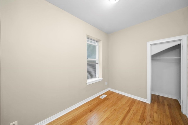 1438 S 50th Ct, Cicero, IL 60804 - unfurnished bedroom with light wood-style flooring and a closet