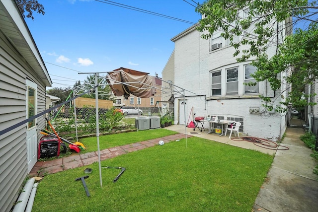 1438 S 50th Ct, Cicero, IL 60804 - view of grassy yard featuring a patio