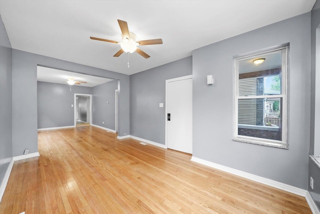 1438 S 50th Ct, Cicero, IL 60804 - unfurnished room featuring a ceiling fan and light wood-style floors