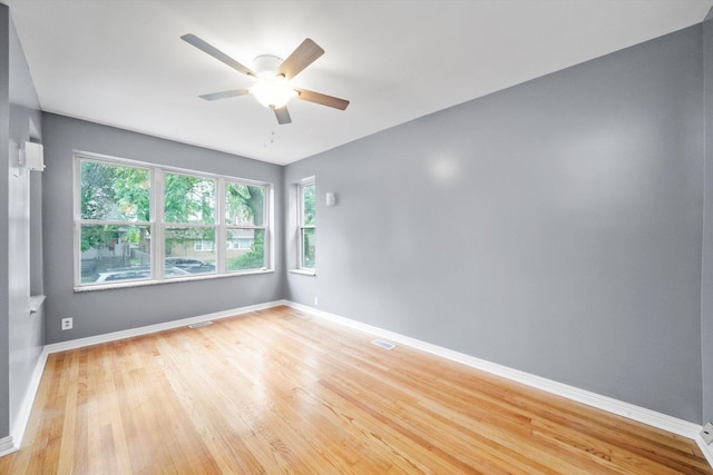 1438 S 50th Ct, Cicero, IL 60804 - unfurnished room with light wood-type flooring, ceiling fan, and healthy amount of natural light