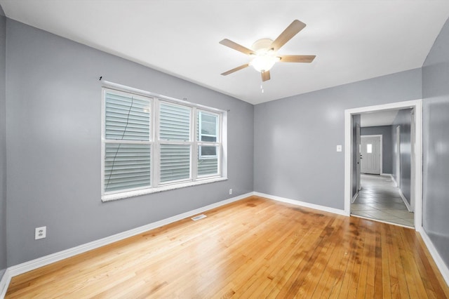 1438 S 50th Ct, Cicero, IL 60804 - unfurnished room featuring a ceiling fan and wood finished floors