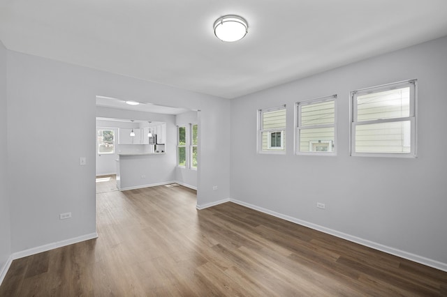 541 N May St, Aurora, IL 60506 - unfurnished living room with wood finished floors and baseboards