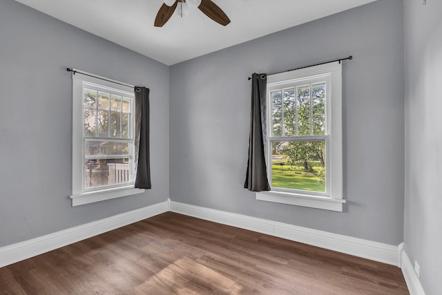 193 May St, Bensenville, IL 60106 - spare room featuring plenty of natural light, ceiling fan, and dark wood-style flooring