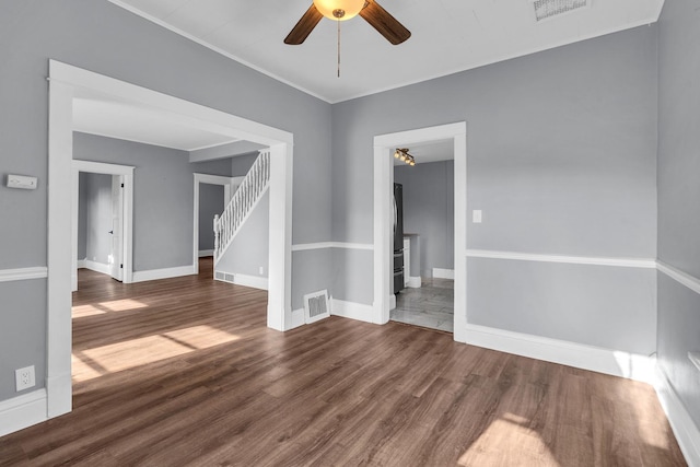 193 May St, Bensenville, IL 60106 - spare room with wood finished floors, a ceiling fan, stairs, and crown molding