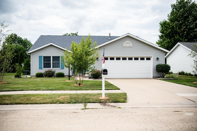 2107 10th Ave, Sterling, IL 61081 - single story home featuring a garage, driveway, a front lawn, and a shingled roof