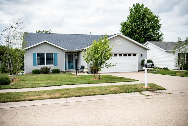 2107 10th Ave, Sterling, IL 61081 - single story home with driveway, an attached garage, a front lawn, and a shingled roof