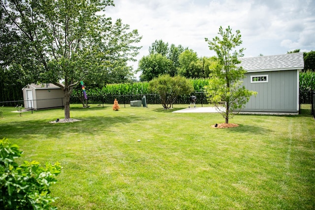 2107 10th Ave, Sterling, IL 61081 - view of yard featuring a storage shed and a patio