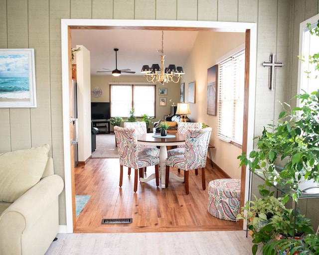 2107 10th Ave, Sterling, IL 61081 - dining space with wood finished floors and a chandelier