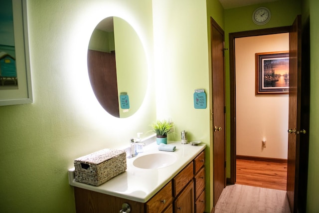 2107 10th Ave, Sterling, IL 61081 - bathroom featuring vanity and wood finished floors