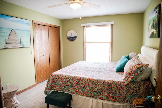 2107 10th Ave, Sterling, IL 61081 - bedroom featuring wood finished floors, a closet, and ceiling fan
