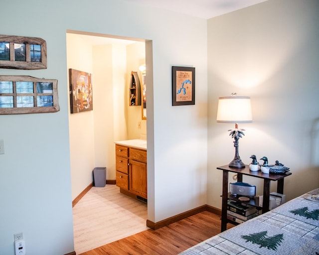 2107 10th Ave, Sterling, IL 61081 - bedroom featuring light wood-type flooring and ensuite bath