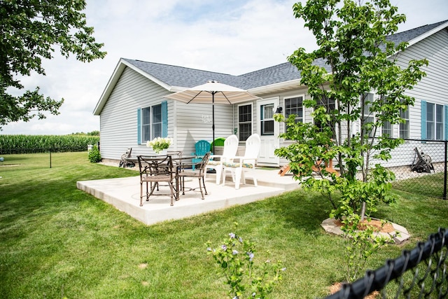 2107 10th Ave, Sterling, IL 61081 - rear view of property with a patio and roof with shingles