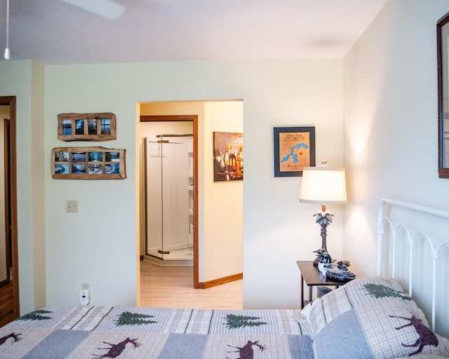 2107 10th Ave, Sterling, IL 61081 - bedroom with light wood finished floors and radiator heating unit