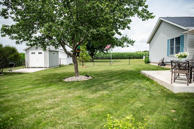 2107 10th Ave, Sterling, IL 61081 - view of green lawn featuring a patio area and an outdoor structure