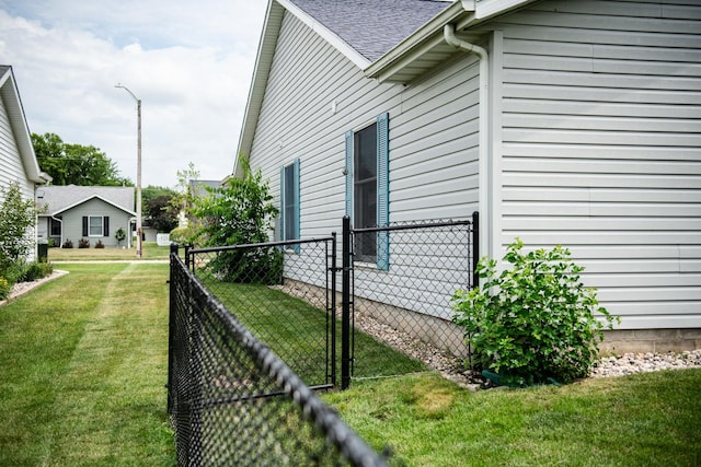 2107 10th Ave, Sterling, IL 61081 - view of home's exterior with a gate