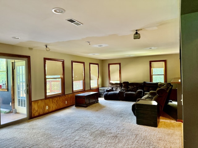 827 N 2199th Rd, Tonica, IL 61370 - living area with healthy amount of natural light, carpet, wood walls, recessed lighting, and wainscoting