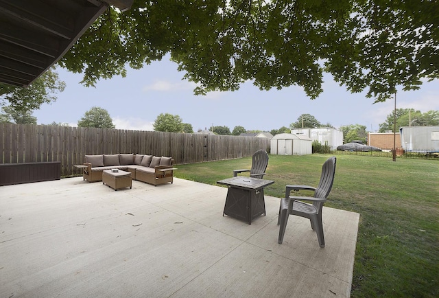 1411 E Hickory St, Streator, IL 61364 - fenced backyard with a patio, a storage unit, and an outdoor living space with a fire pit
