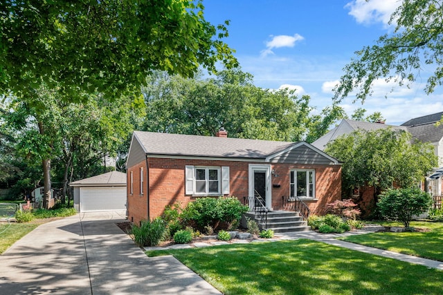 505 W Alexander Blvd, Elmhurst, IL 60126 - view of front facade featuring brick siding, an outbuilding, a detached garage, and a front lawn