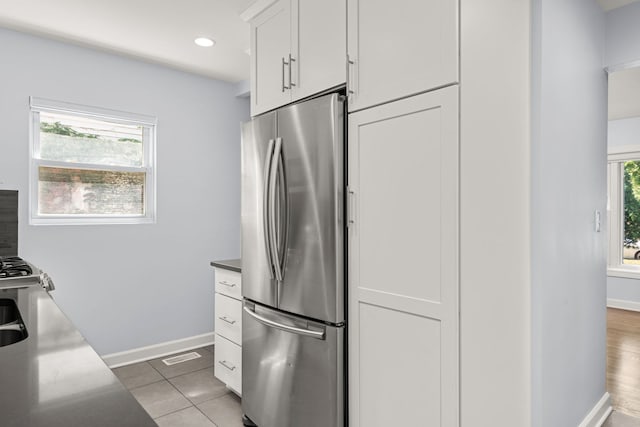 505 W Alexander Blvd, Elmhurst, IL 60126 - kitchen featuring freestanding refrigerator, white cabinetry, light tile patterned floors, and recessed lighting