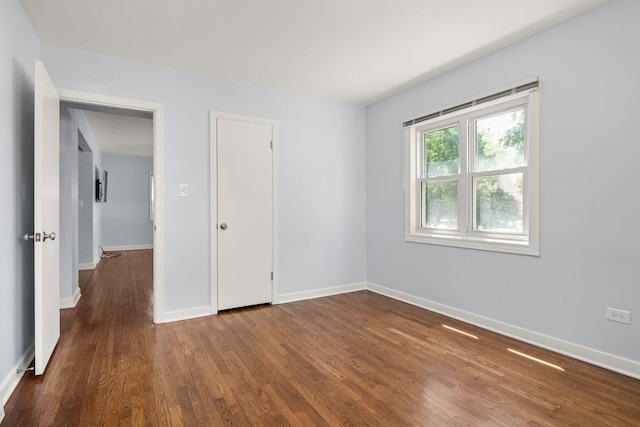 505 W Alexander Blvd, Elmhurst, IL 60126 - unfurnished bedroom featuring dark wood-type flooring and baseboards