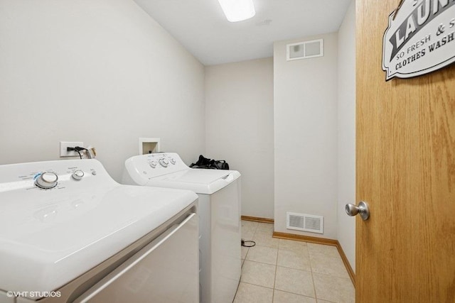 711 Creekside Cir Unit 711, Gurnee, IL 60031 - laundry room featuring independent washer and dryer and light tile patterned floors